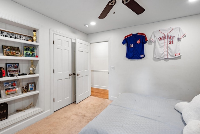 carpeted bedroom with ceiling fan