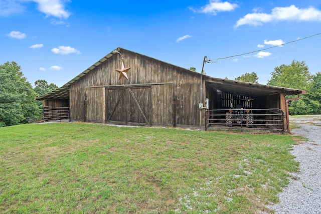 view of outbuilding with a lawn