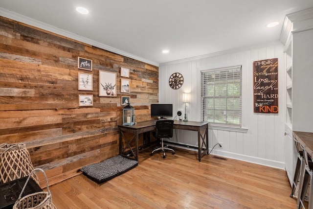 office featuring hardwood / wood-style flooring, crown molding, and wooden walls