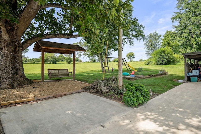 exterior space featuring a playground and a patio area