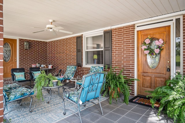 view of exterior entry featuring ceiling fan