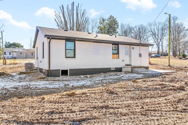 rear view of property with central air condition unit