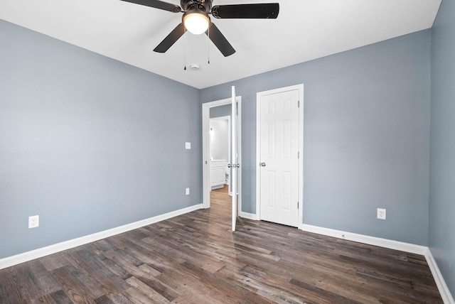 unfurnished bedroom featuring ceiling fan and dark wood-type flooring