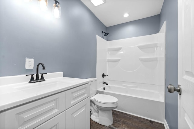 full bathroom featuring shower / bathing tub combination, vanity, wood-type flooring, and toilet