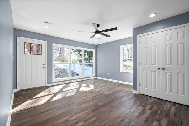 interior space featuring ceiling fan and dark hardwood / wood-style floors