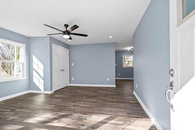 entryway featuring ceiling fan and dark hardwood / wood-style flooring