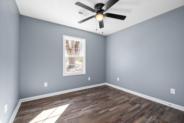 unfurnished room featuring ceiling fan and dark hardwood / wood-style flooring