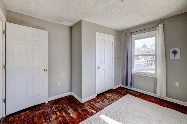 unfurnished bedroom with a textured ceiling