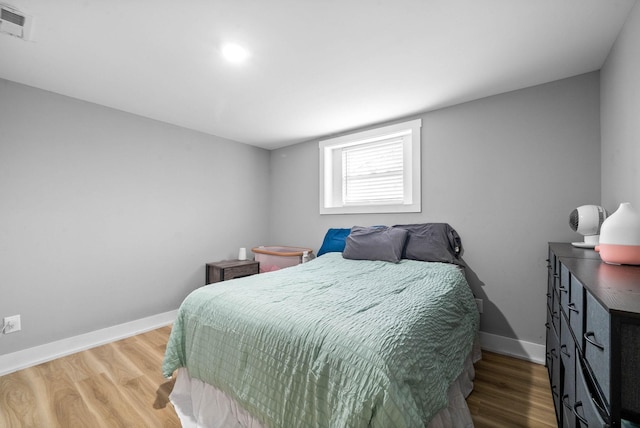 bedroom featuring hardwood / wood-style floors