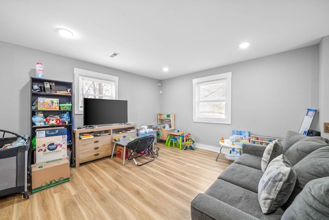 rec room with hardwood / wood-style floors