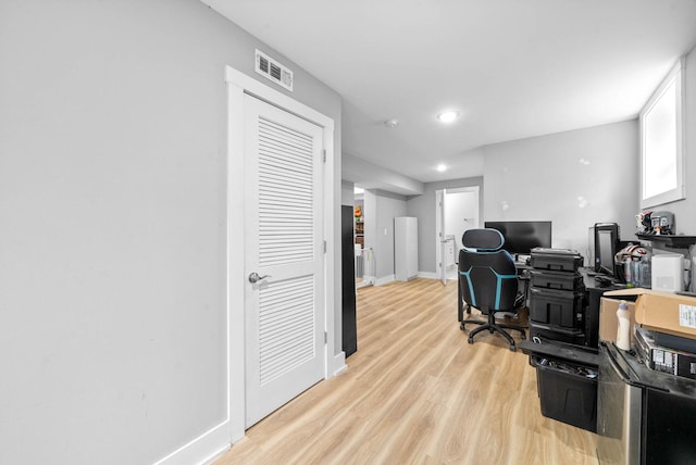 office with light hardwood / wood-style floors