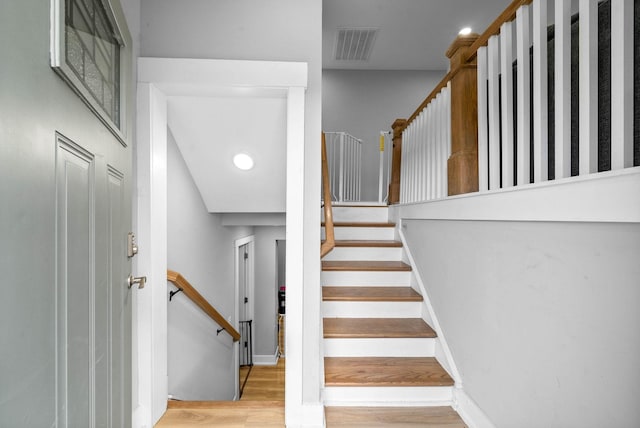 staircase featuring hardwood / wood-style floors