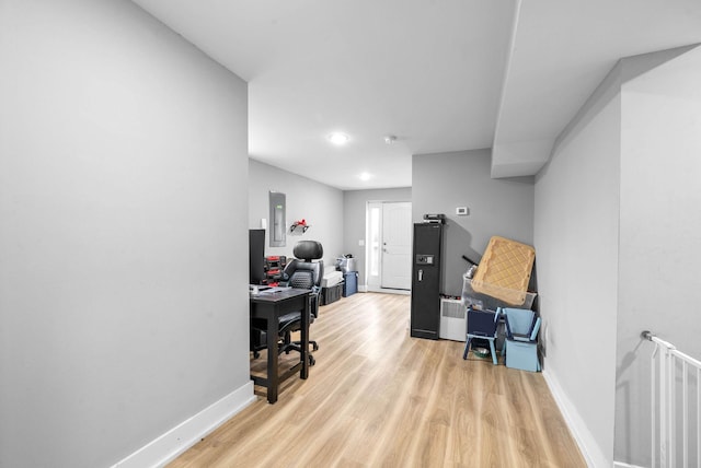 office area featuring light hardwood / wood-style floors and electric panel