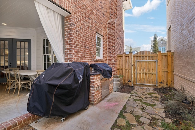 view of patio / terrace with grilling area and french doors