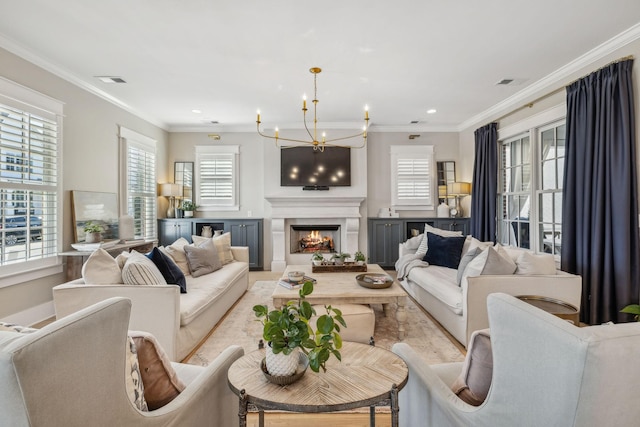 living room with an inviting chandelier and ornamental molding