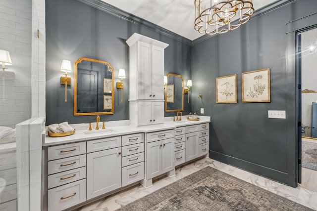 bathroom featuring vanity, a notable chandelier, and crown molding