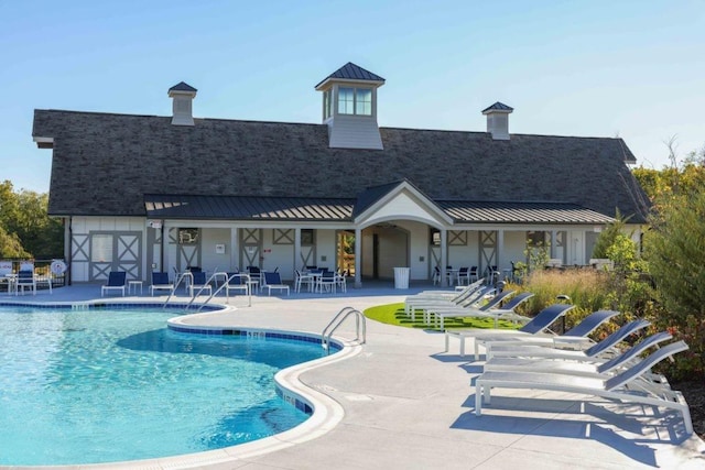 view of pool featuring a patio area