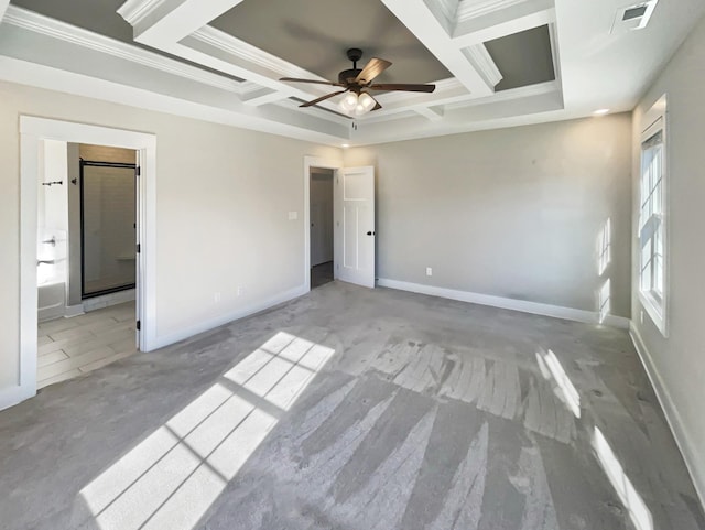 unfurnished bedroom featuring light carpet, ceiling fan, ensuite bath, ornamental molding, and coffered ceiling