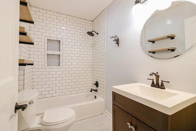 full bathroom featuring vanity, toilet, and tiled shower / bath combo