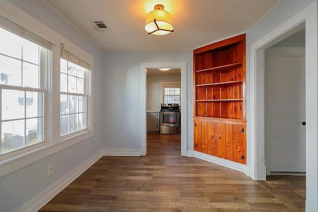 hallway with dark hardwood / wood-style floors