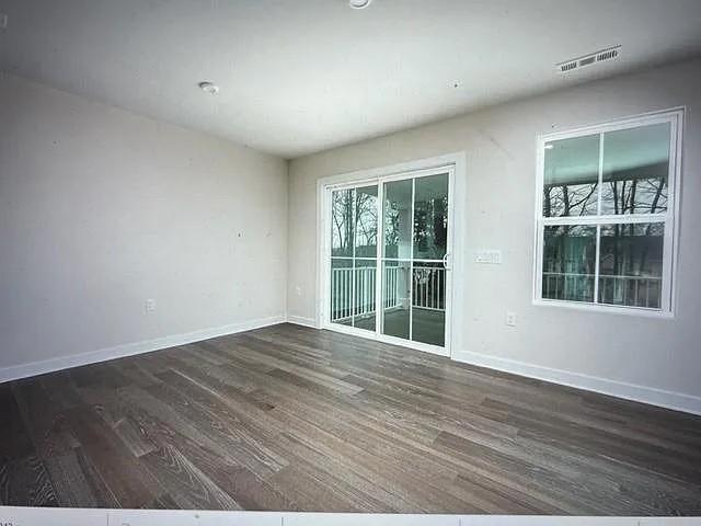 empty room featuring dark hardwood / wood-style floors