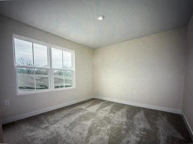 empty room featuring carpet flooring