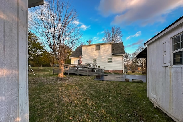 view of yard featuring a patio area and a deck