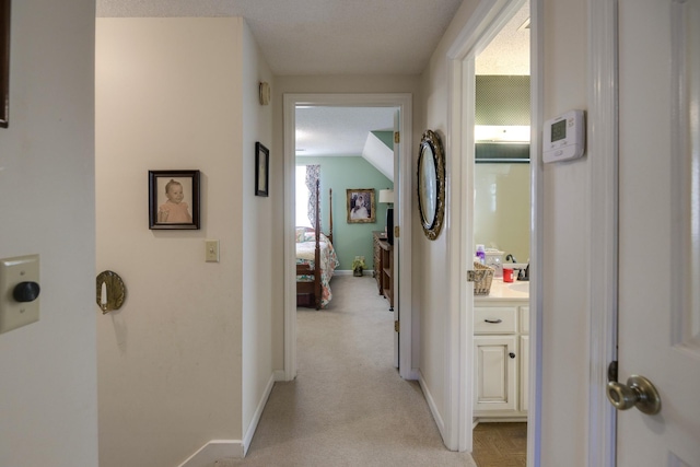 hallway featuring a textured ceiling