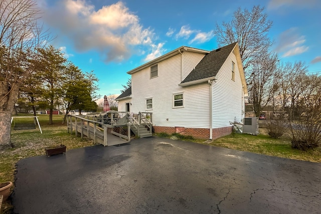 back of property with a deck