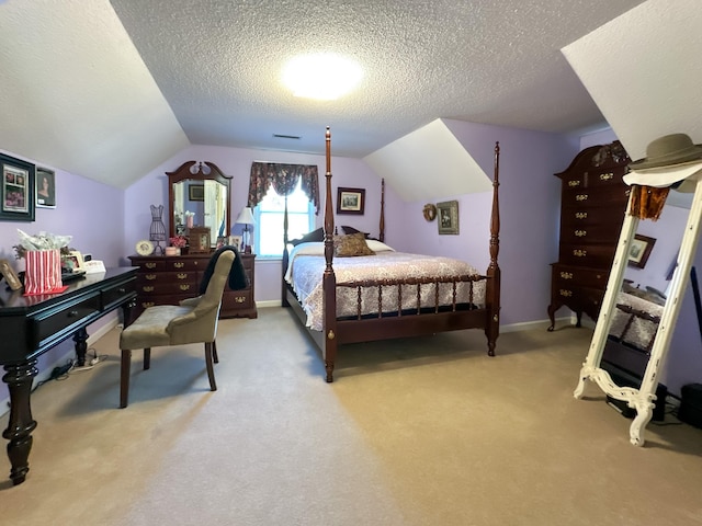 bedroom featuring a textured ceiling, vaulted ceiling, and carpet