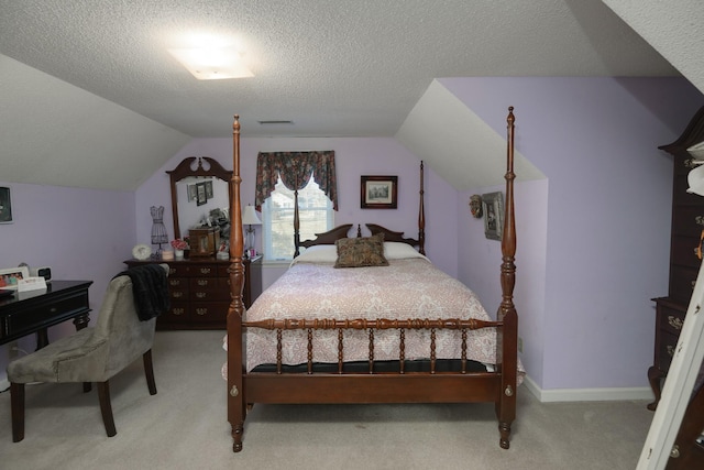 bedroom with a textured ceiling, light colored carpet, and lofted ceiling