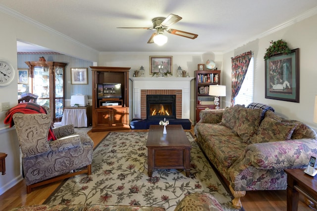 living room with ornamental molding, light hardwood / wood-style flooring, and a fireplace