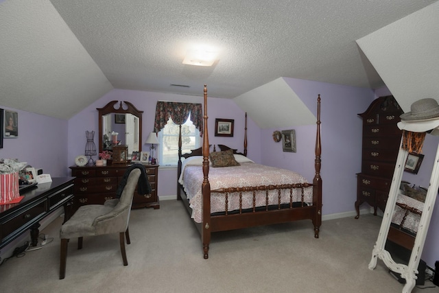 bedroom with light colored carpet, a textured ceiling, and lofted ceiling