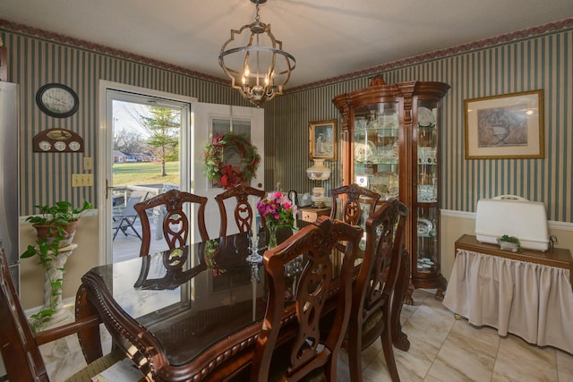 dining room featuring a chandelier and light tile patterned floors