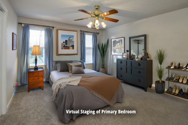 bedroom featuring ceiling fan and light carpet