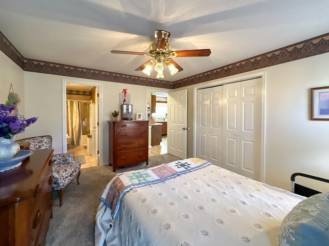 carpeted bedroom featuring a closet and ceiling fan