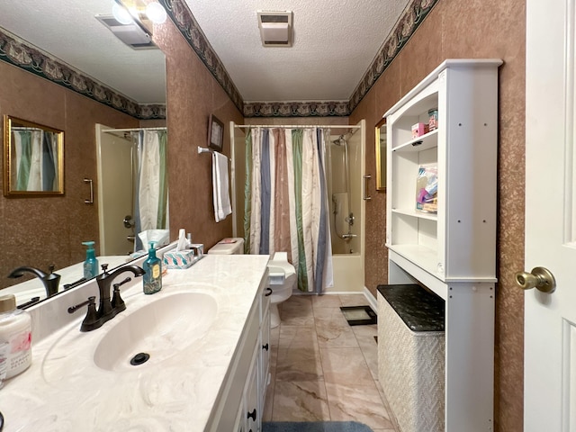 full bathroom featuring vanity, toilet, shower / bath combination with curtain, and a textured ceiling