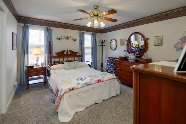 bedroom with ceiling fan and carpet