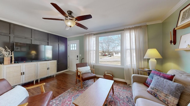 living room with ceiling fan, dark hardwood / wood-style flooring, and crown molding