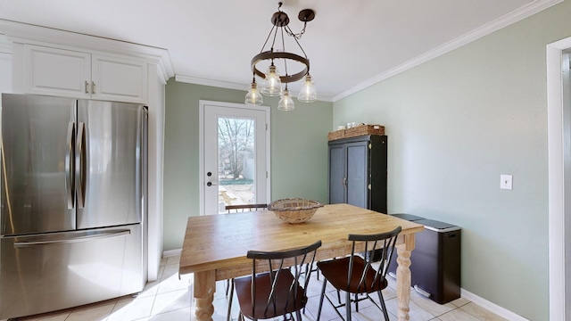 tiled dining room featuring crown molding