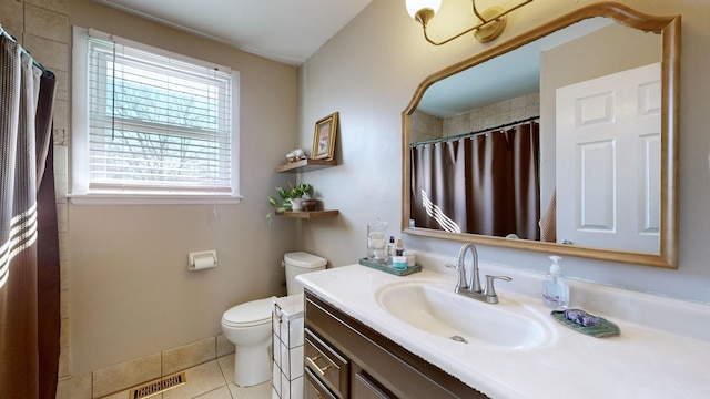 bathroom with toilet, vanity, a shower with curtain, and tile patterned flooring