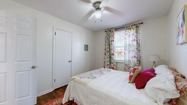 bedroom featuring ceiling fan and dark hardwood / wood-style floors