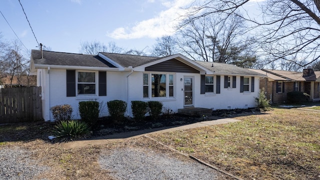 single story home featuring a front lawn