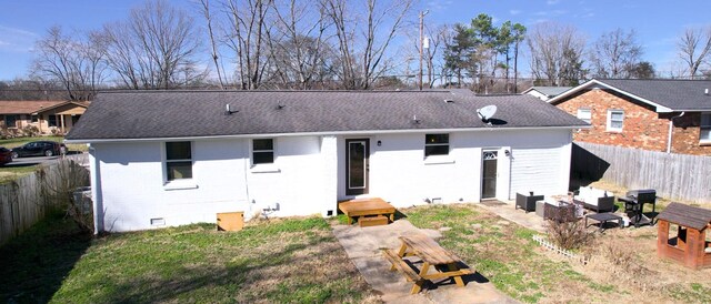 rear view of house with a patio area and an outdoor living space