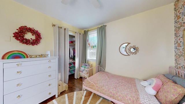 bedroom with ceiling fan and dark hardwood / wood-style flooring