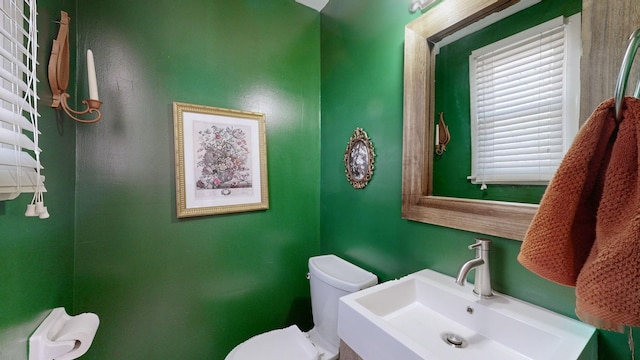 bathroom with toilet and sink