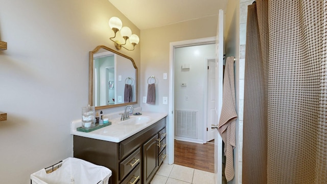 bathroom with tile patterned floors and vanity