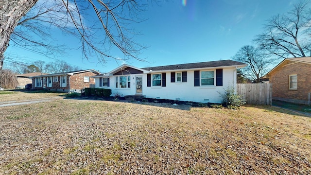 ranch-style home with a front lawn