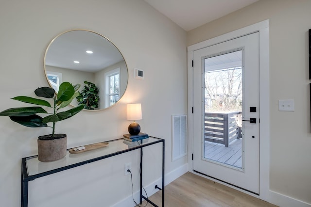 doorway to outside featuring light hardwood / wood-style floors