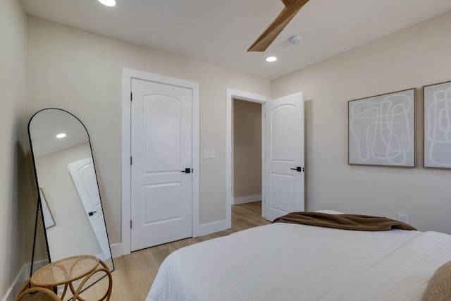 bedroom featuring ceiling fan and light hardwood / wood-style floors